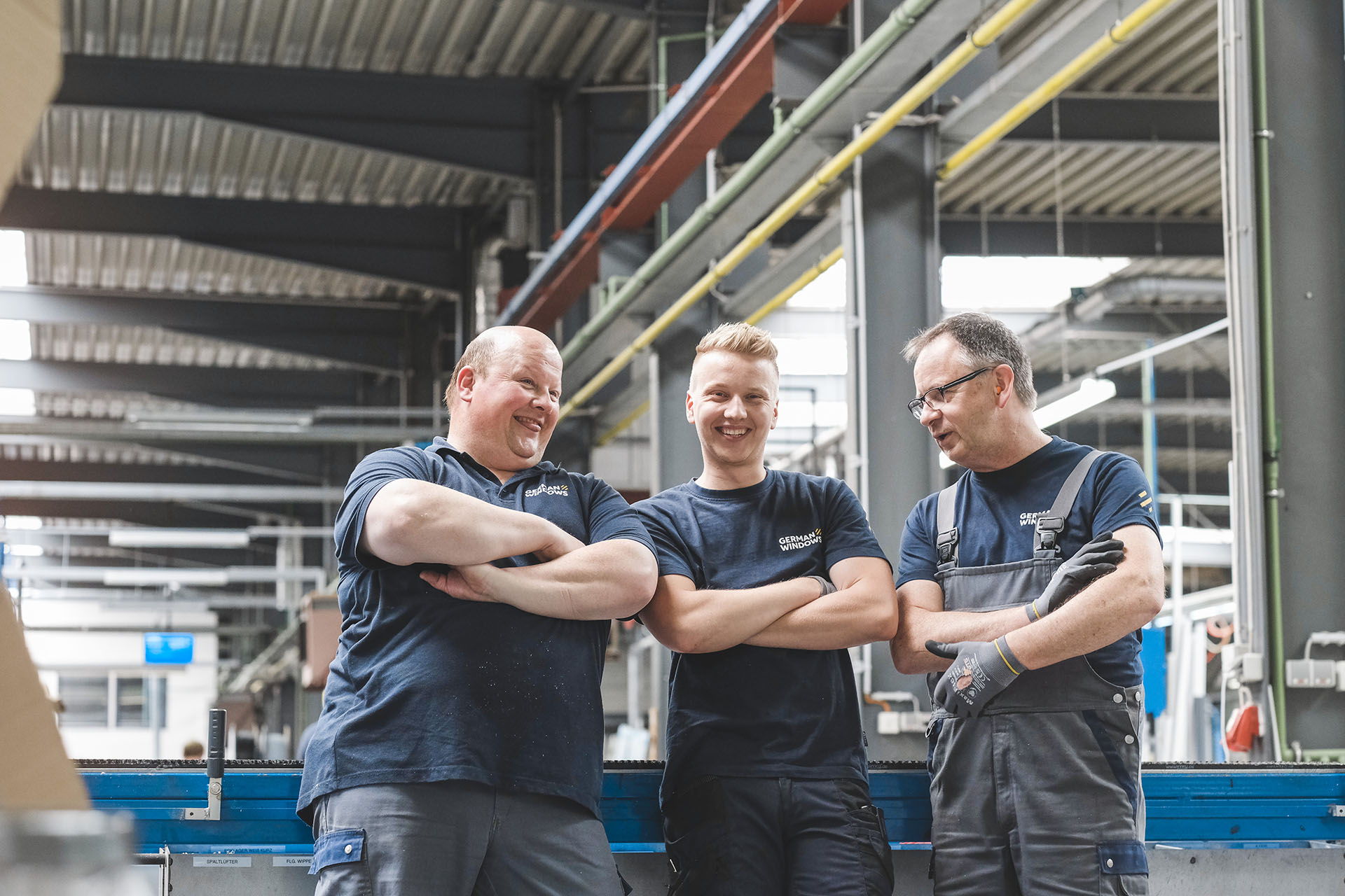 drei German Windows Mitarbeiter posieren für ein Bild